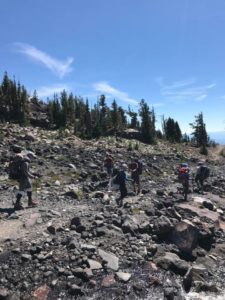 Young men hiking up Morrison Creek drainage on Mt. Adams